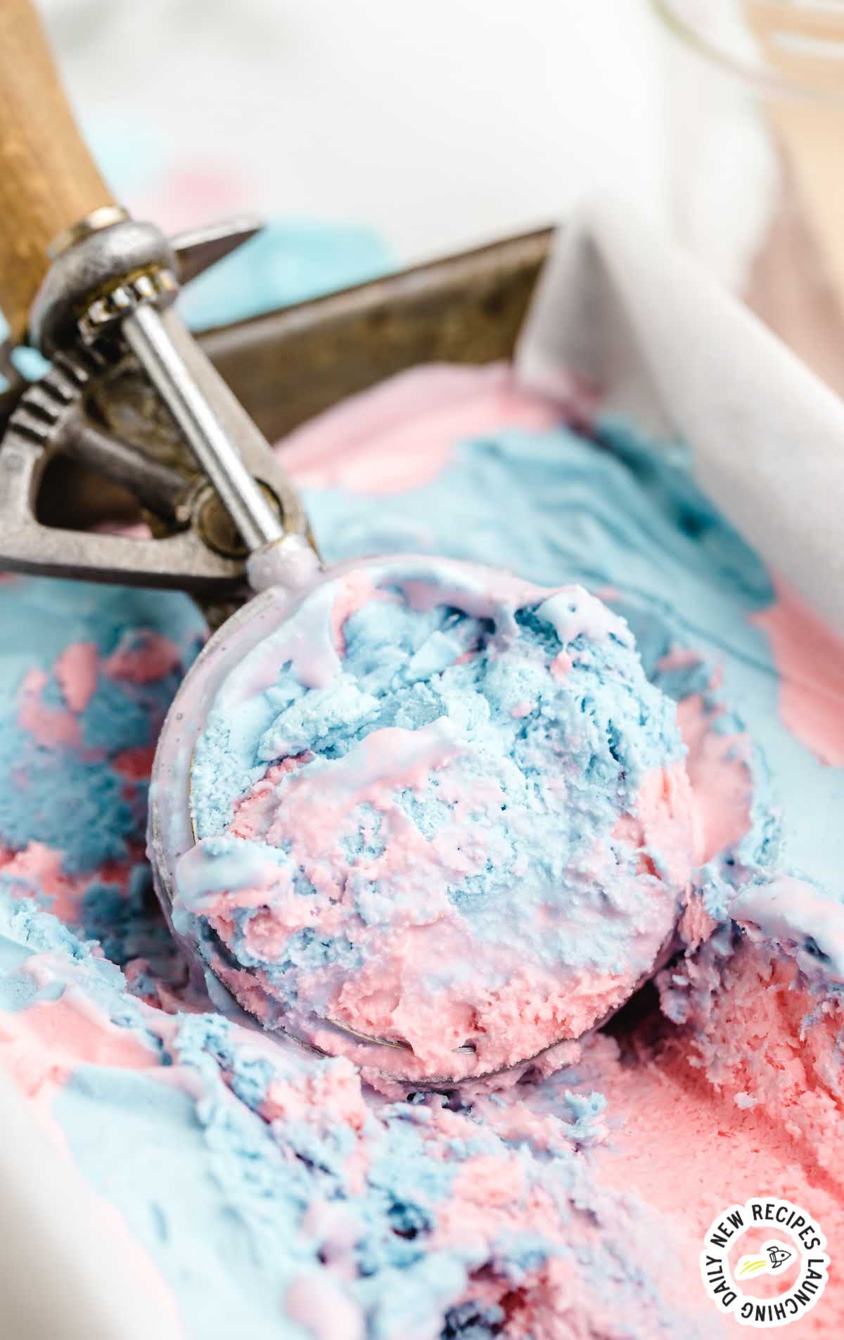 scoop of No-Churn Cotton Candy Ice Cream in a ice cream scooper