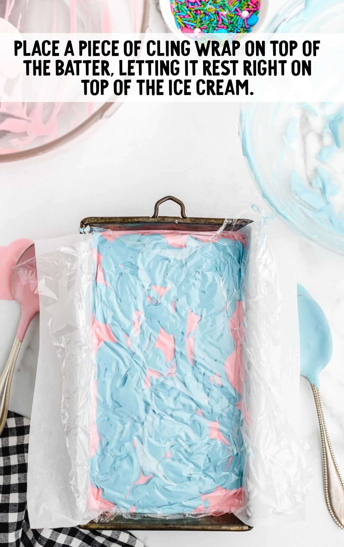 wrap placed on top of No-Churn Cotton Candy Ice Cream in a loaf pan