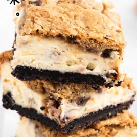 pieces of Oreo Chocolate Chip Cheesecake Cookie Bars stacked on top of each other