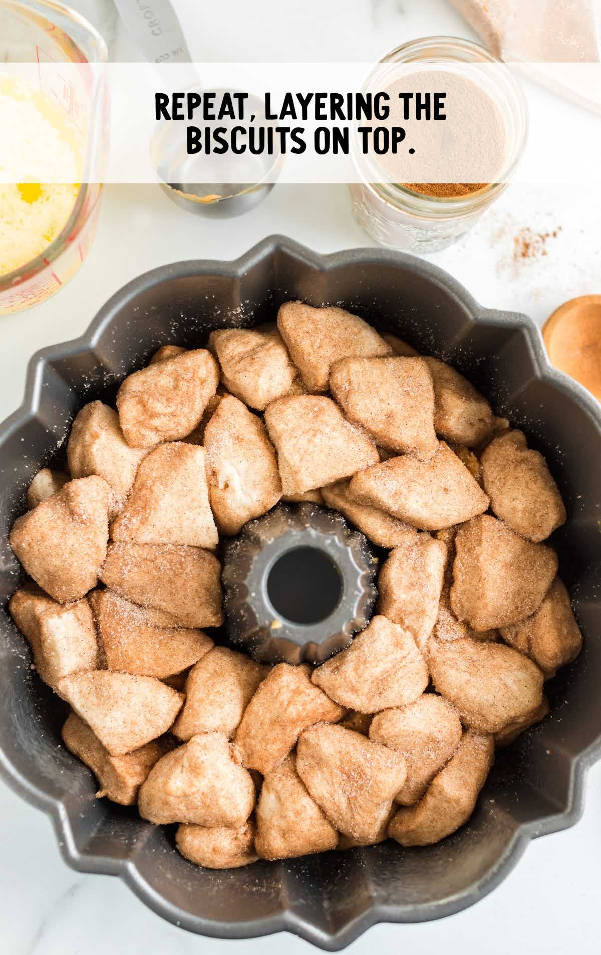 more biscuits placed into the bundt pan