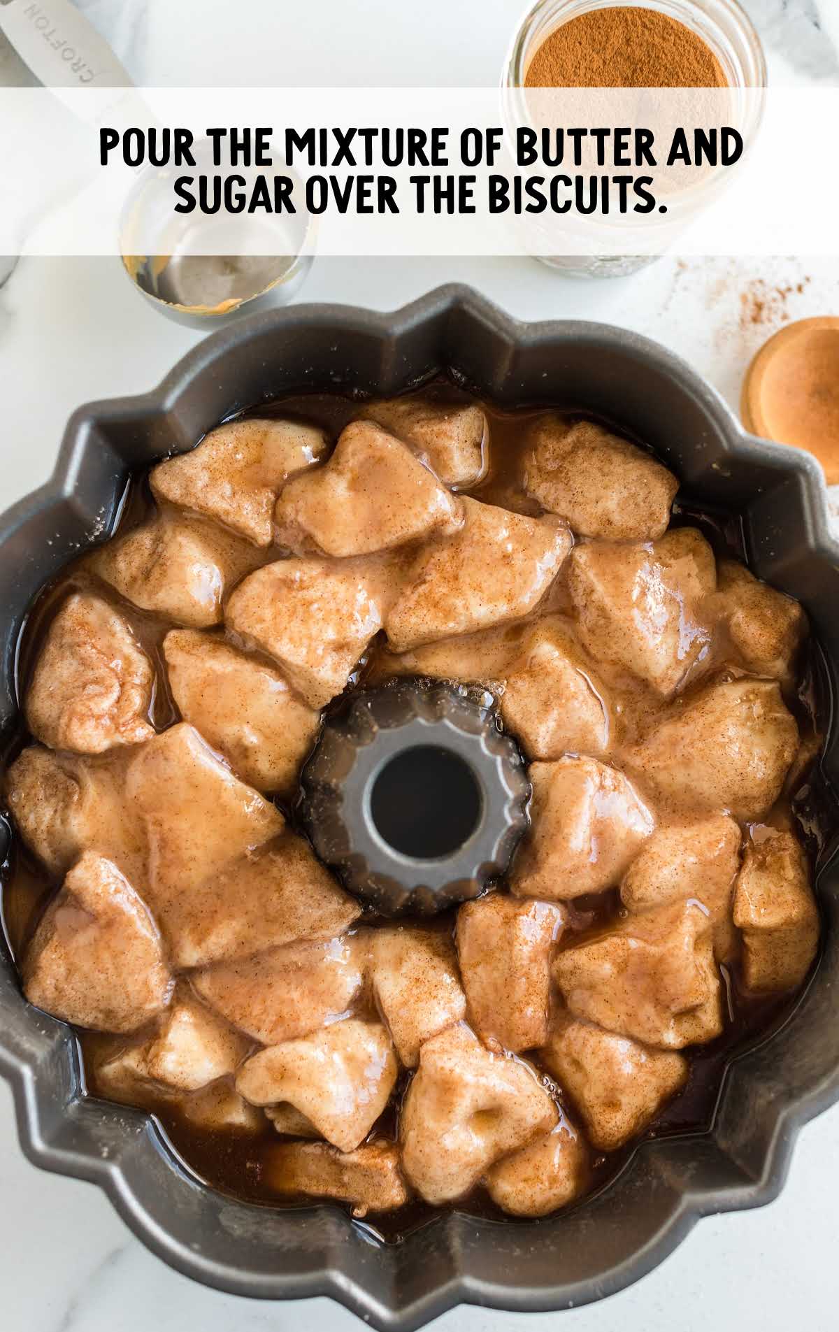 butter and sugar mixture poured on top of the biscuits in the bundt pan