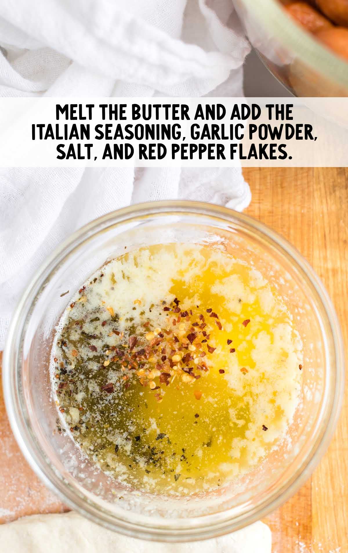 melted butter and seasonings added to a bowl