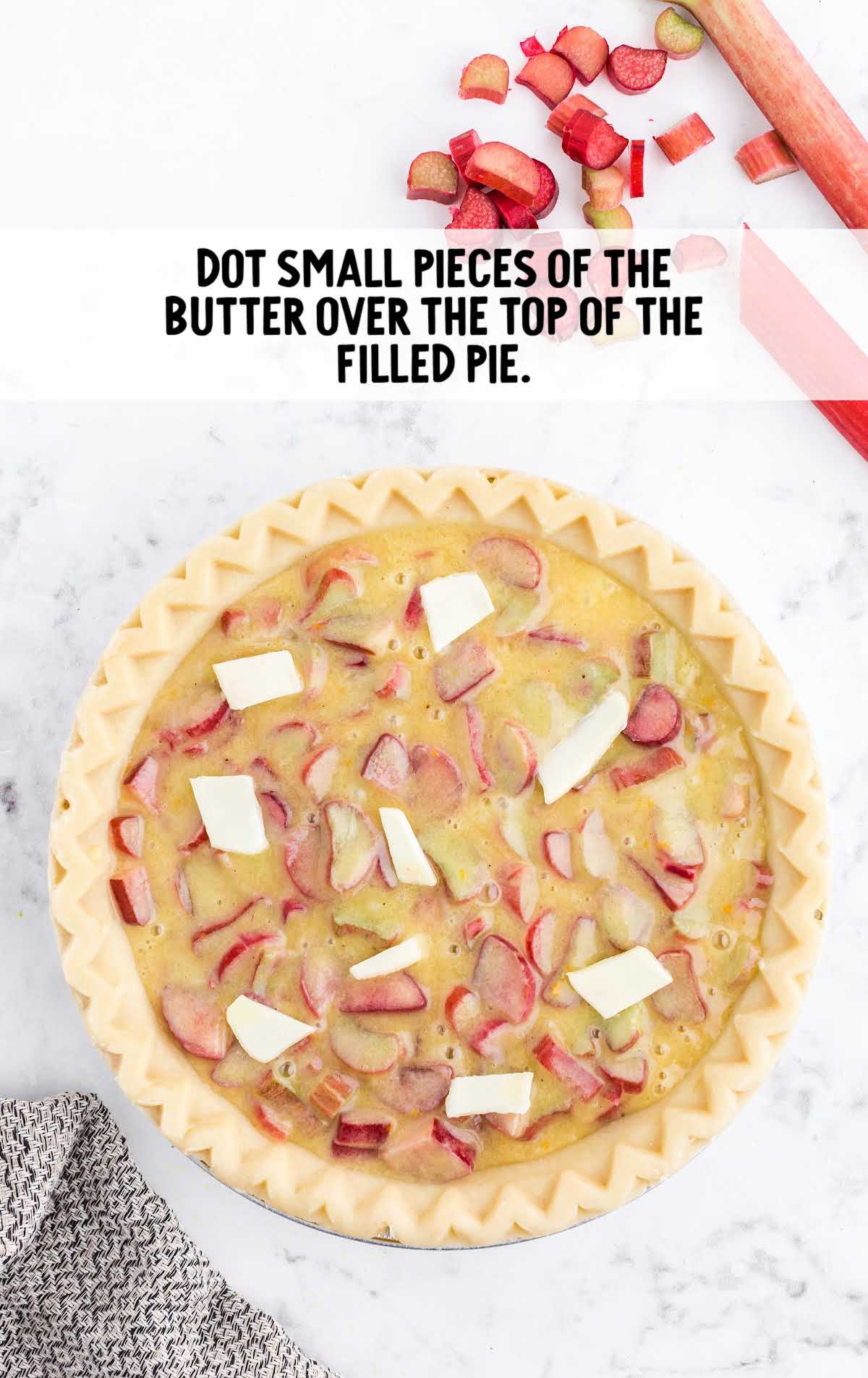 pieces of butter place on top of the pie