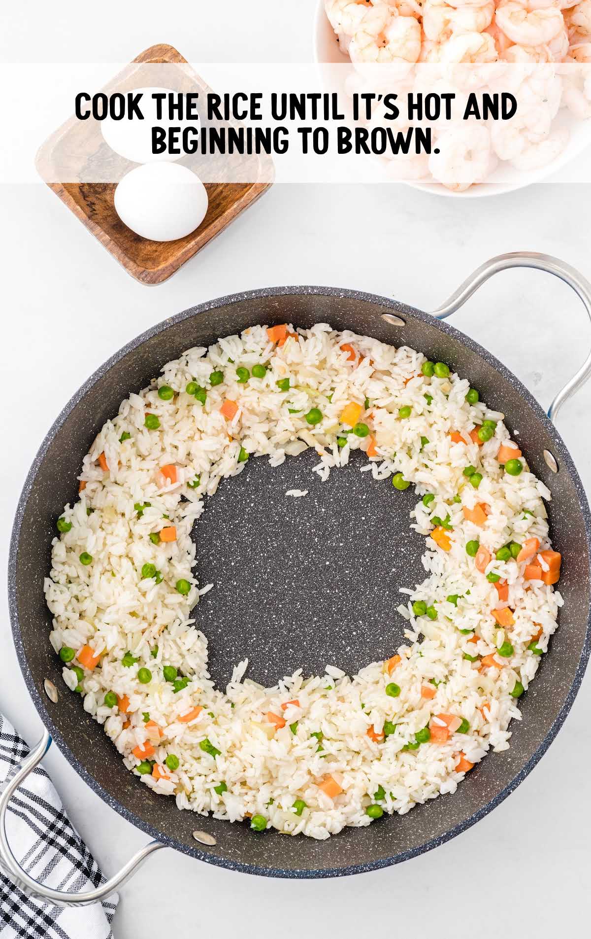 rice added to the skillet of vegetables and onion