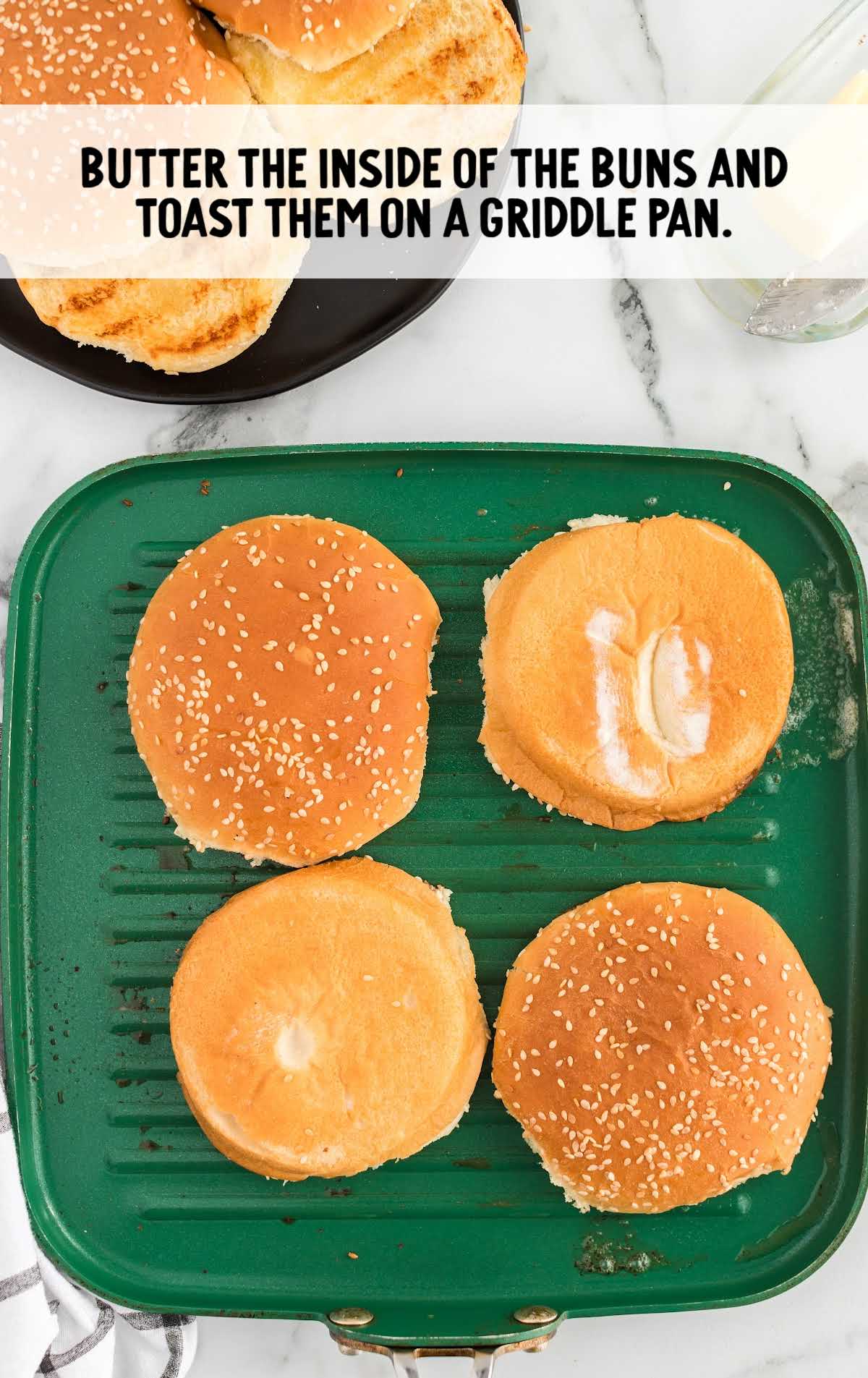 buns being toasted on a griddle pan