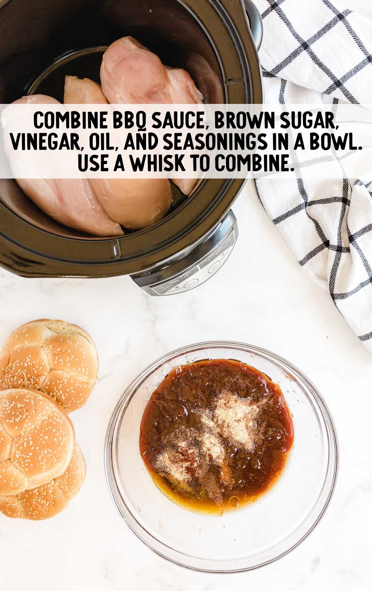 bbq sauce, brown sugar, vinegar, oil, and seasoning whisked in a bowl