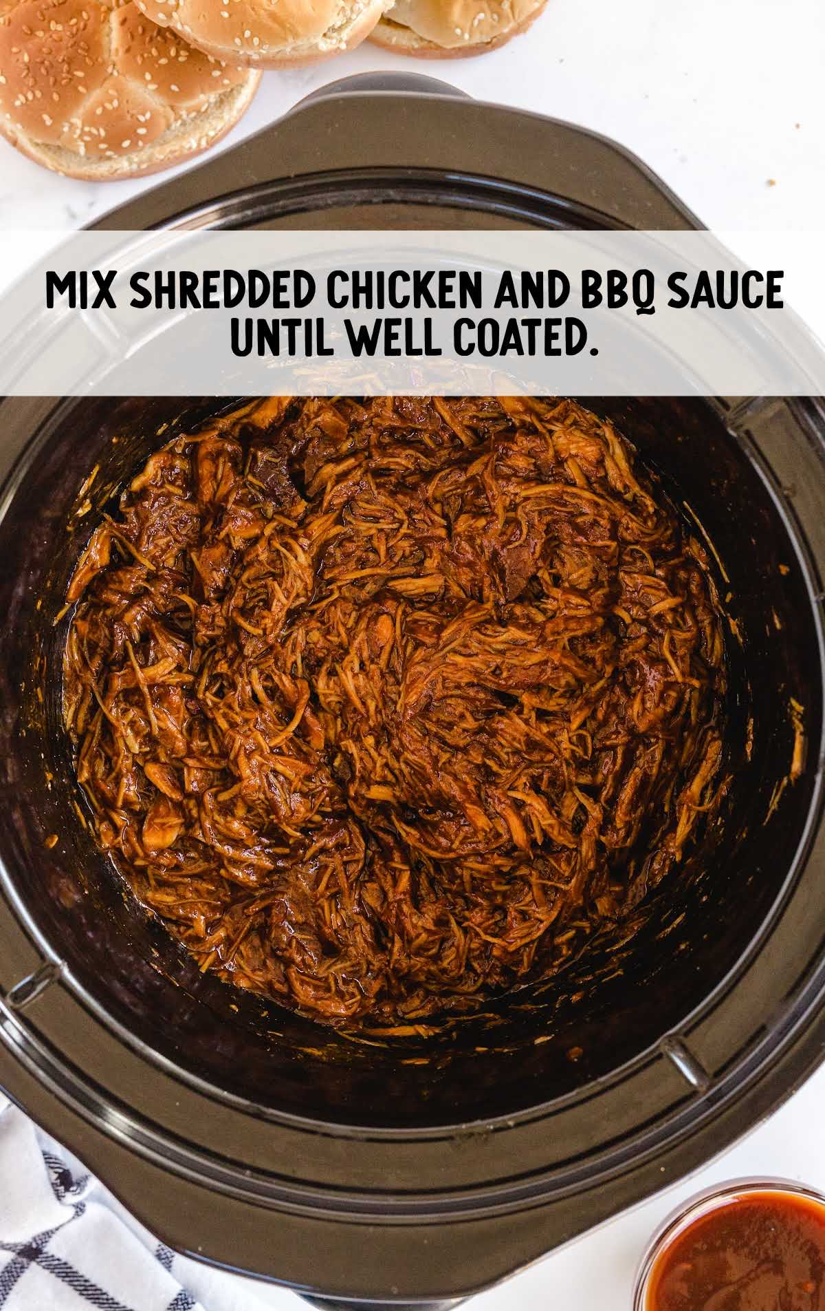 chicken shredded and combined with the bbq sauce mixture in the slow cooker