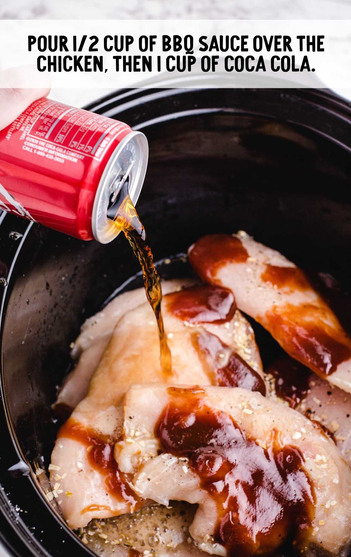 bbq sauce and coca-cola added to the chicken breast in the slow cooker