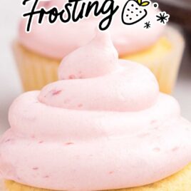 a close up shot of a cupcake topped with Strawberry Cream Cheese Frosting