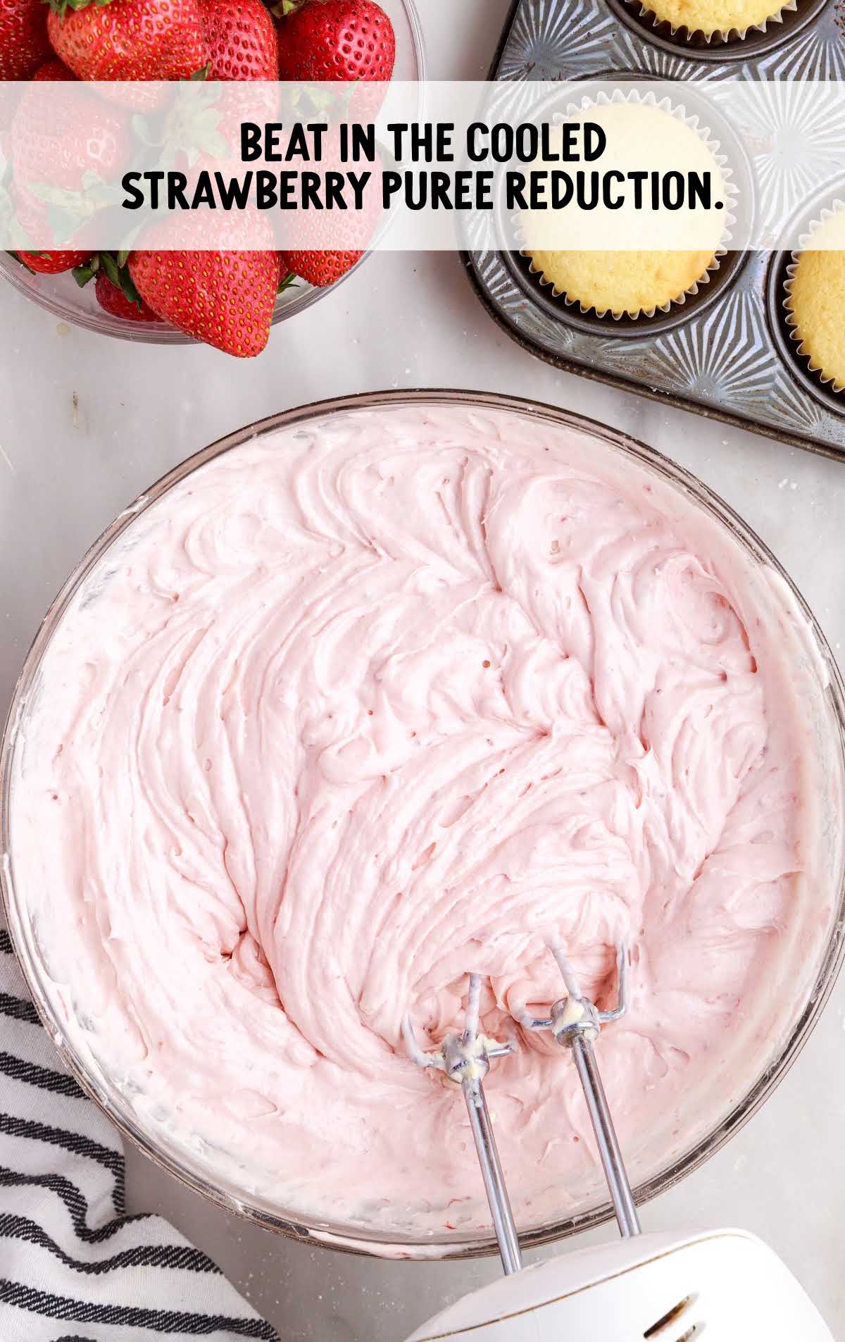 strawberry puree blended into the cream cheese mixture in a bowl
