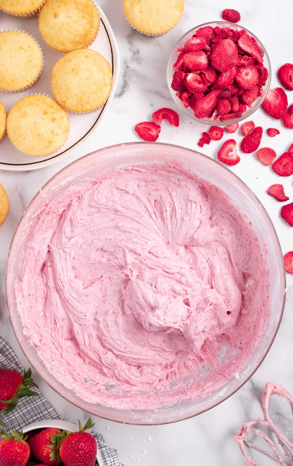 overhead shot of a big bowl of Strawberry Cream Cheese Frosting