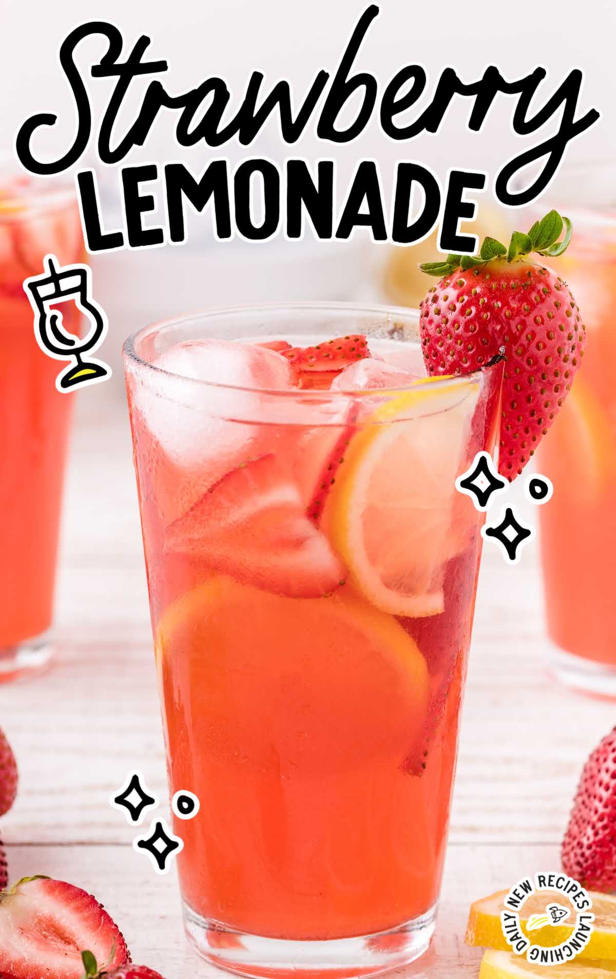 close up shot of a glass full of Strawberry Lemonade garnished with strawberries and lemon