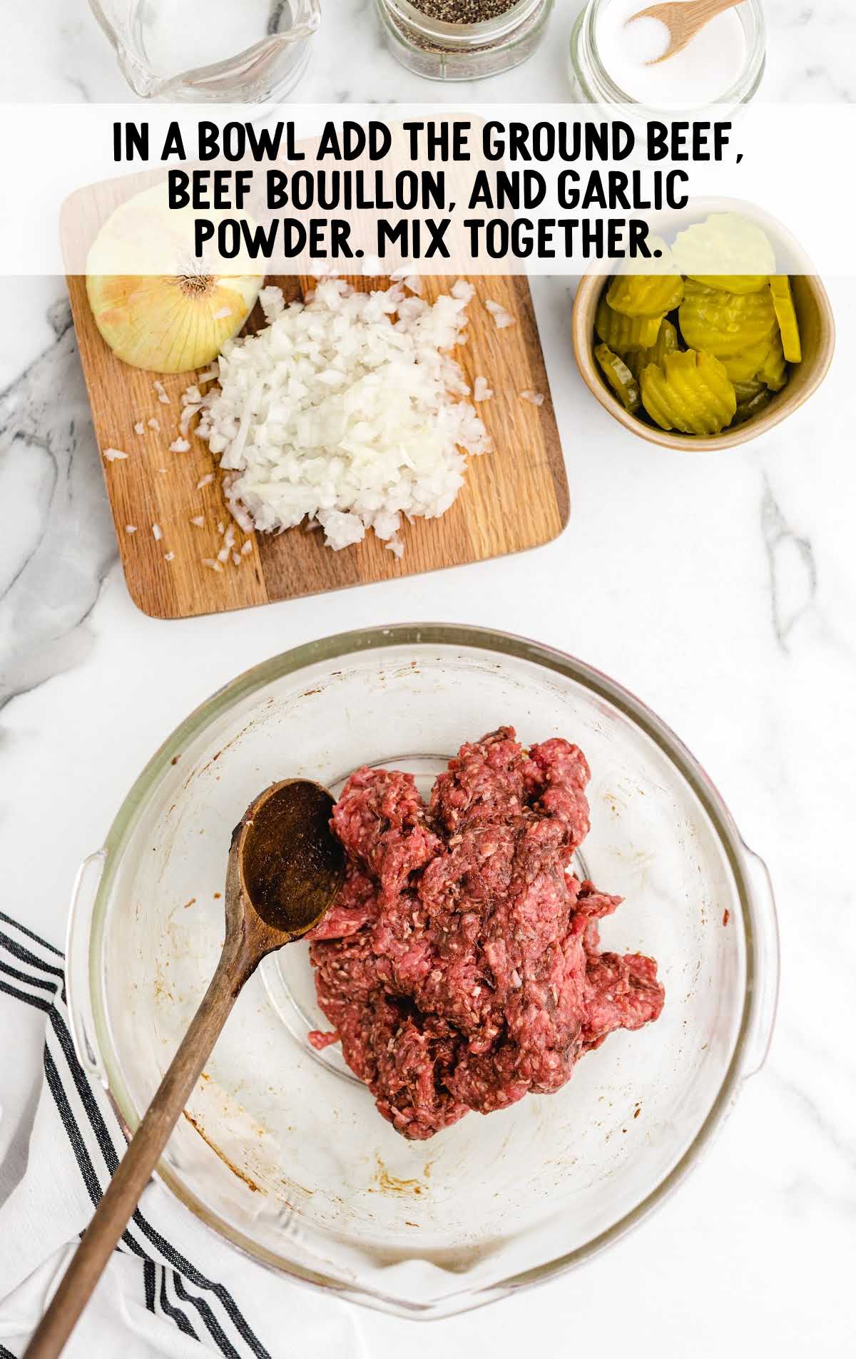 ground beef, Better Than Bouillon Beef, and garlic powder combined in a bowl