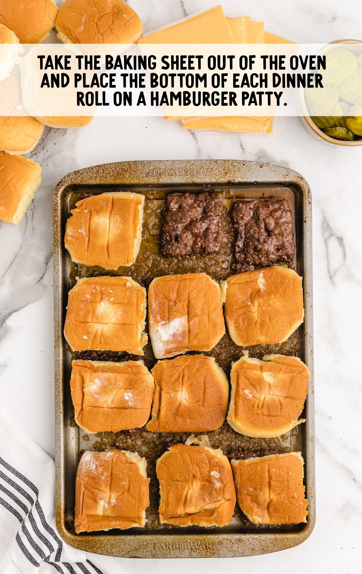 buns placed on top of the ground beef patties