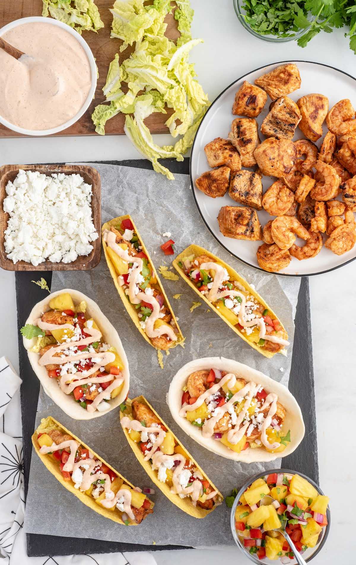 overhead shot of Chicken and Shrimp Tacos and ingredients