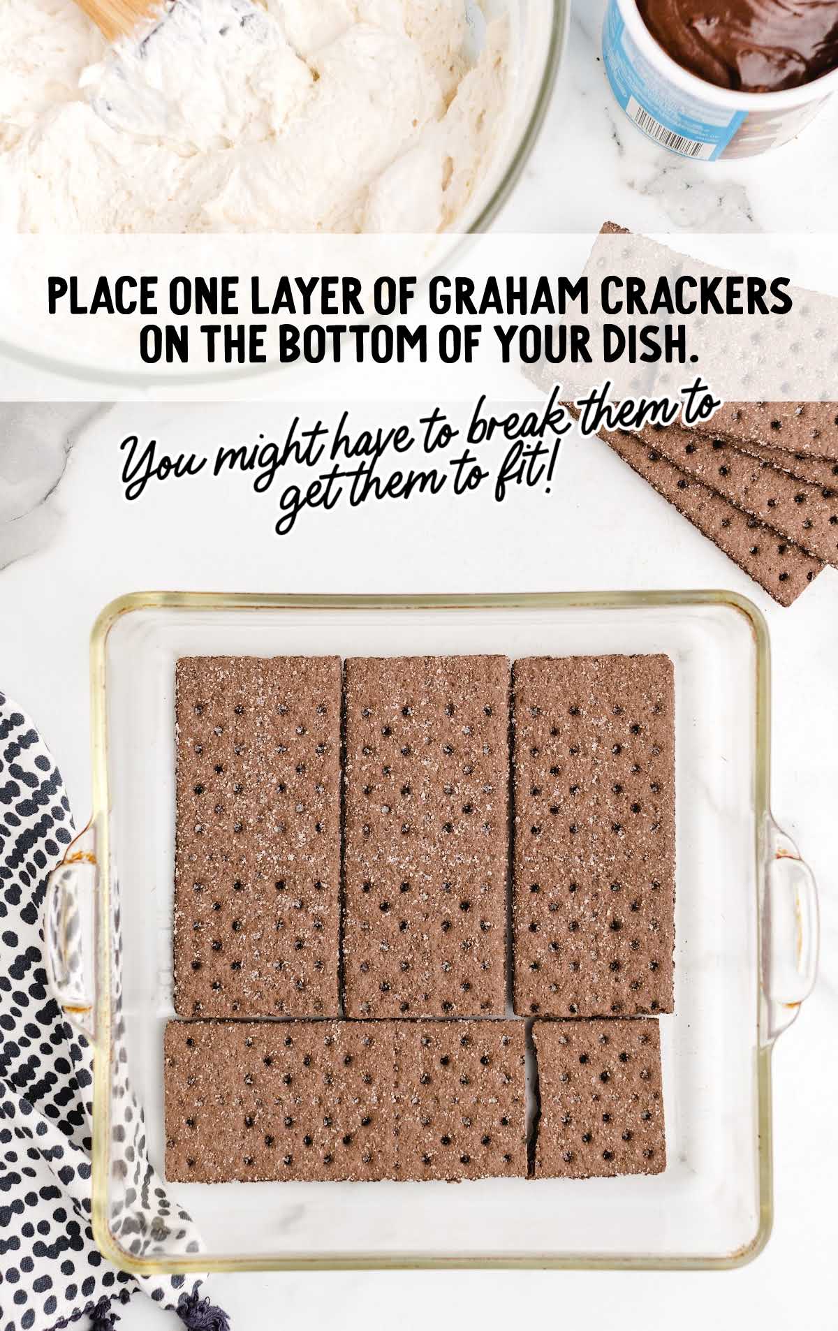 graham cracker crumbs layered at the bottom of a baking dish