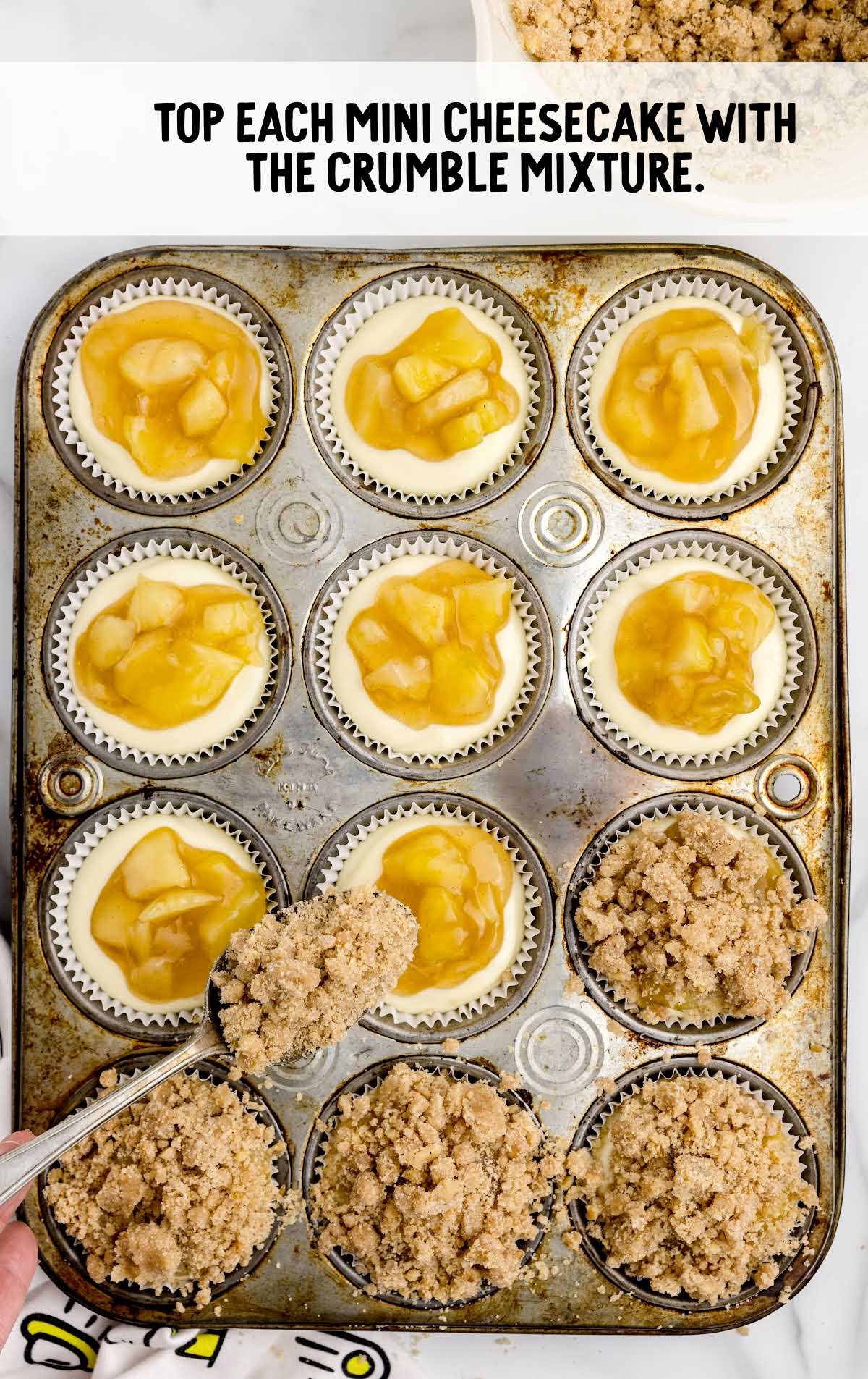 mini apple cheesecakes topped with the graham cracker crumb mixture