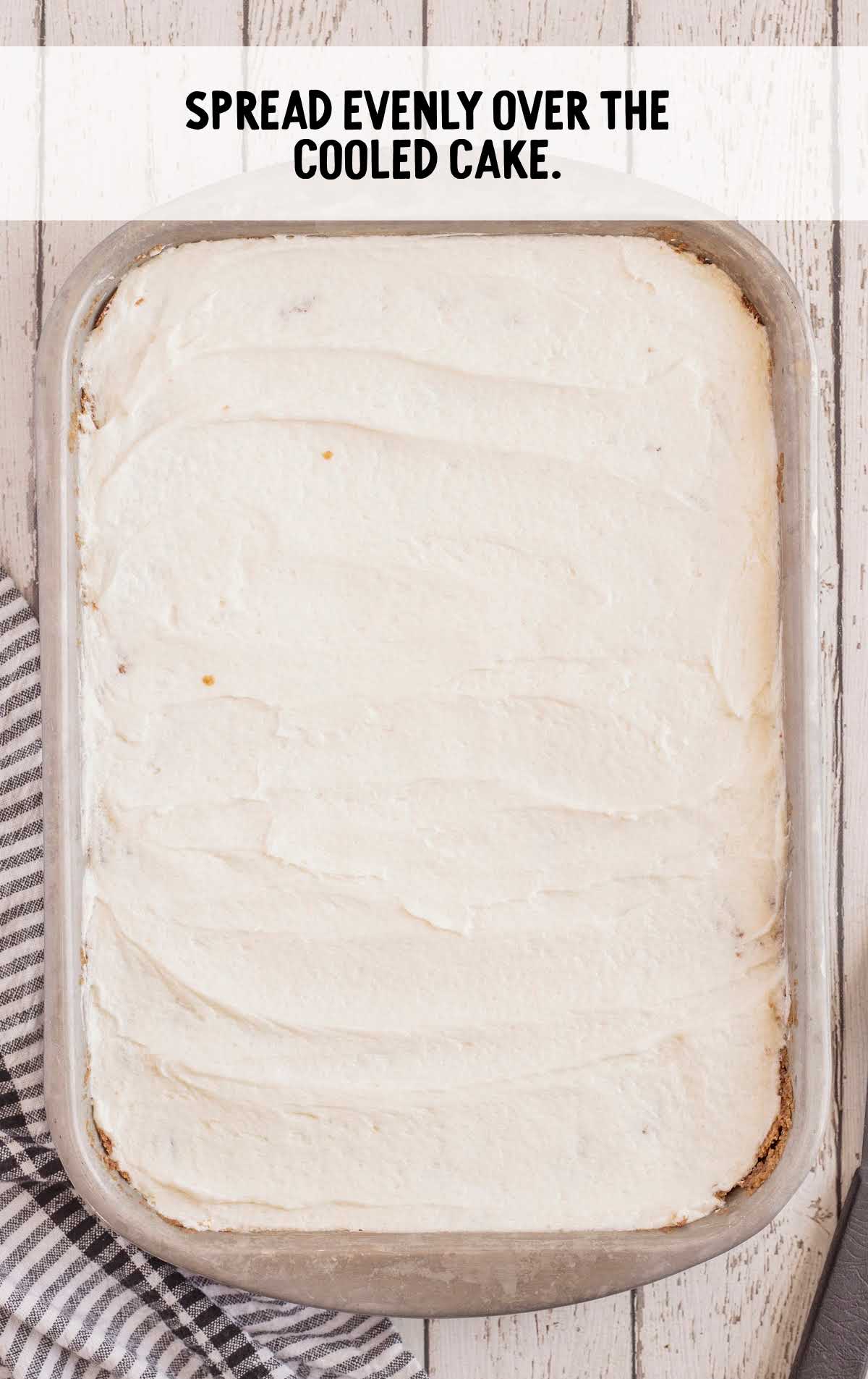 cake cooled and frosted in a baking dish
