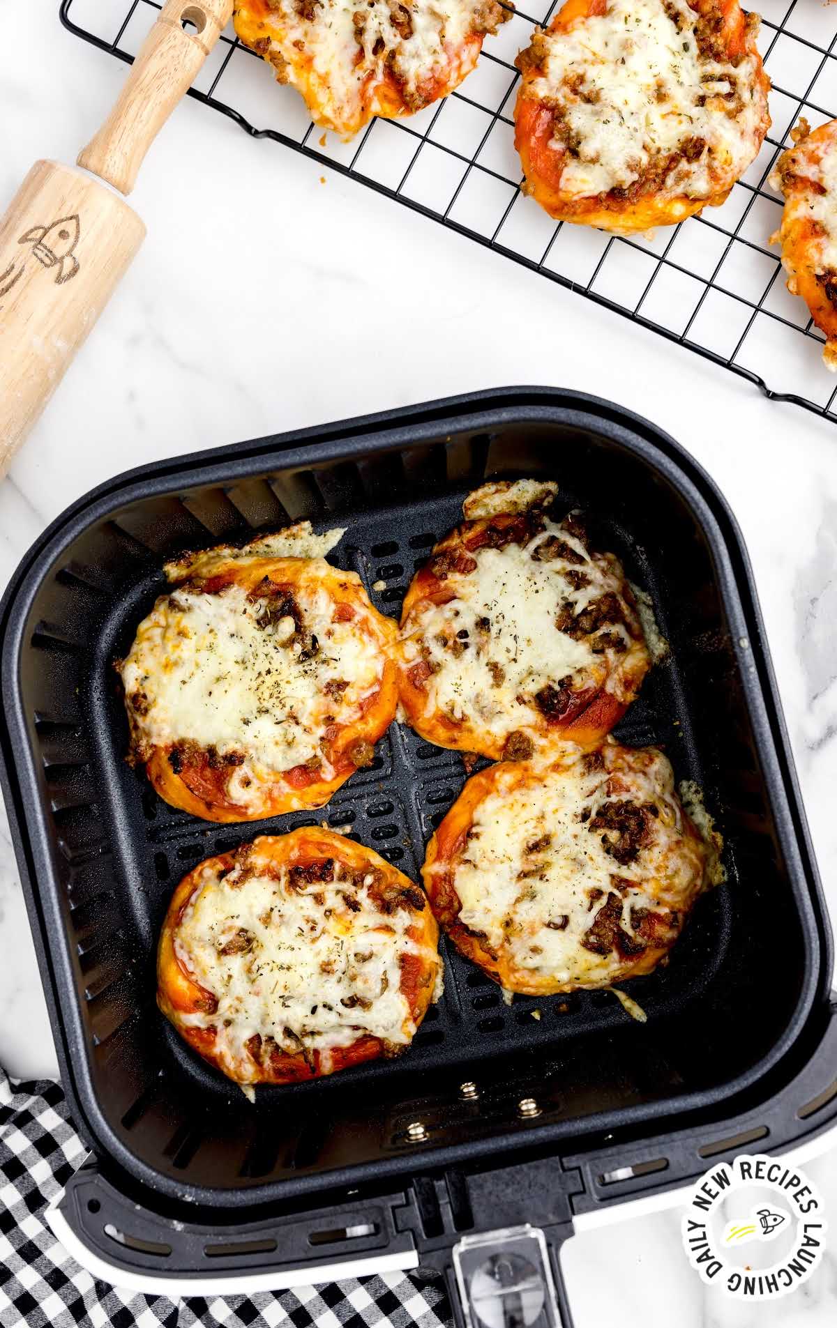 slices of Air Fryer Pizzas in a air fryer