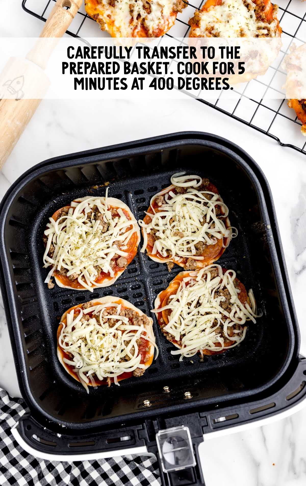 uncooked Air Fryer Pizzas in a air fryer