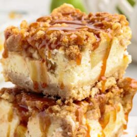 close up shot of slices of Apple Cheesecake Bars stacked on top of each other