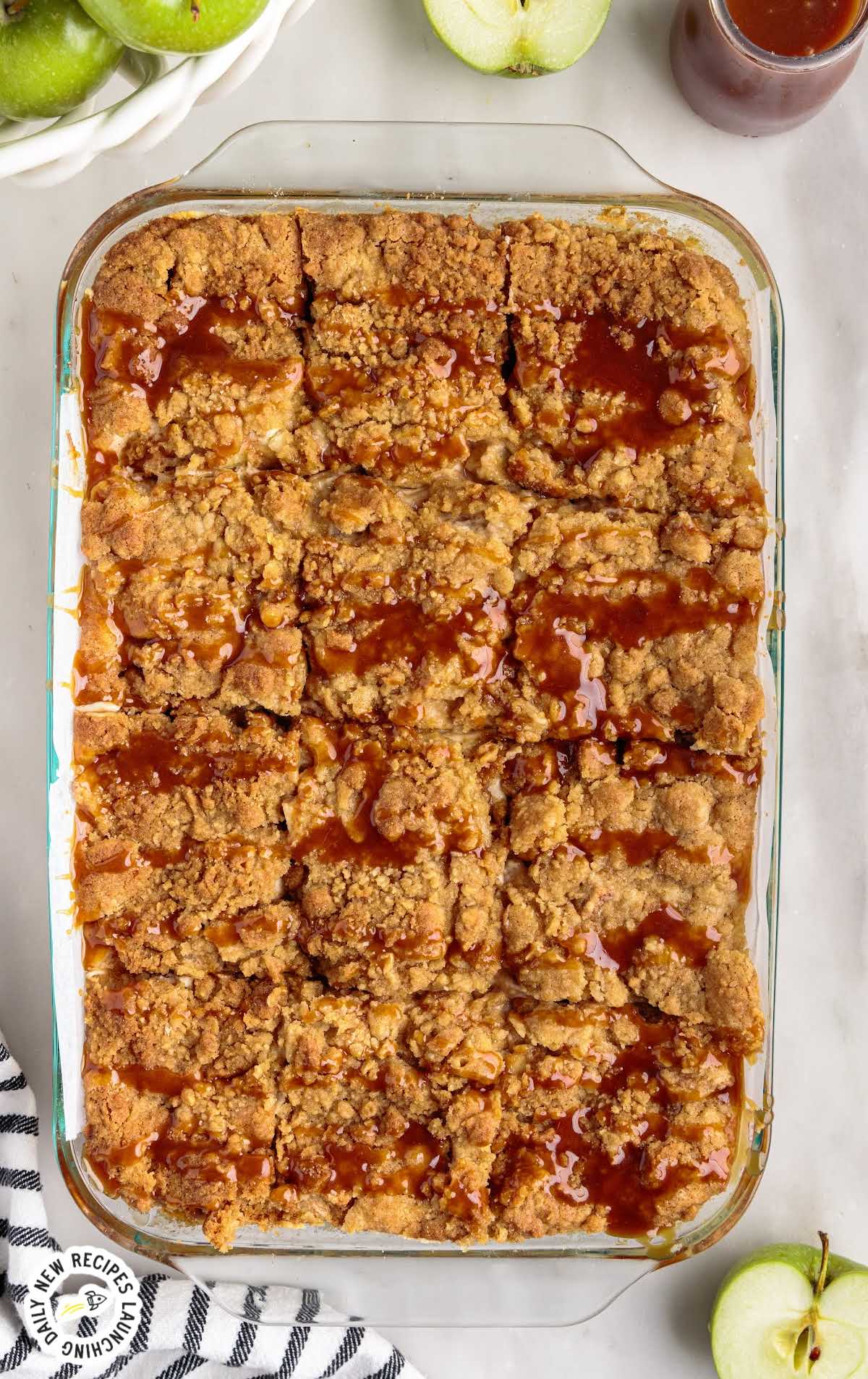overhead shot of Apple Cheesecake Bars in a baking dish