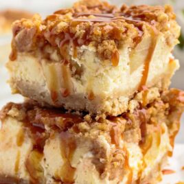 close up shot of slices of Apple Cheesecake Bars stacked on top of each other