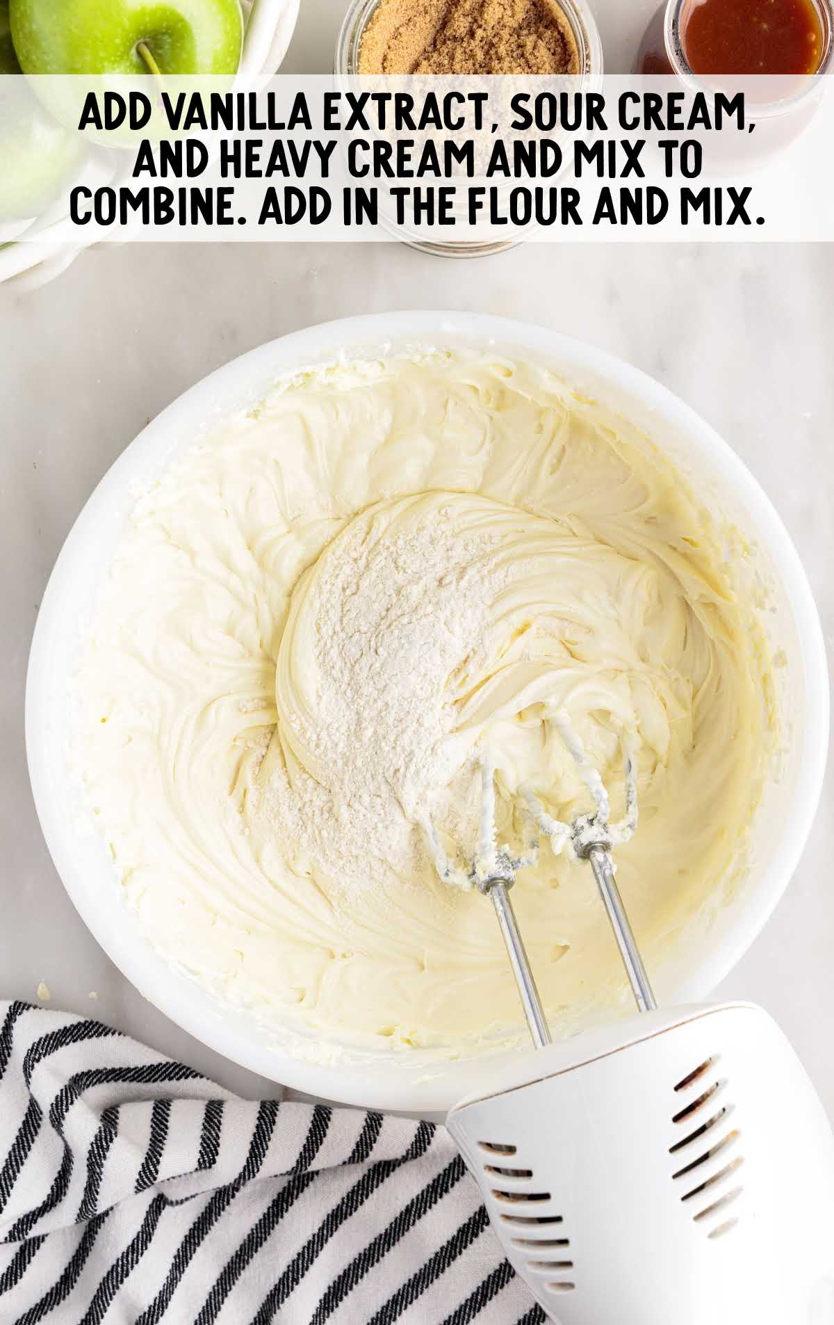 vanilla extract, sour cream, heavy cream, and flour blended together in a bowl