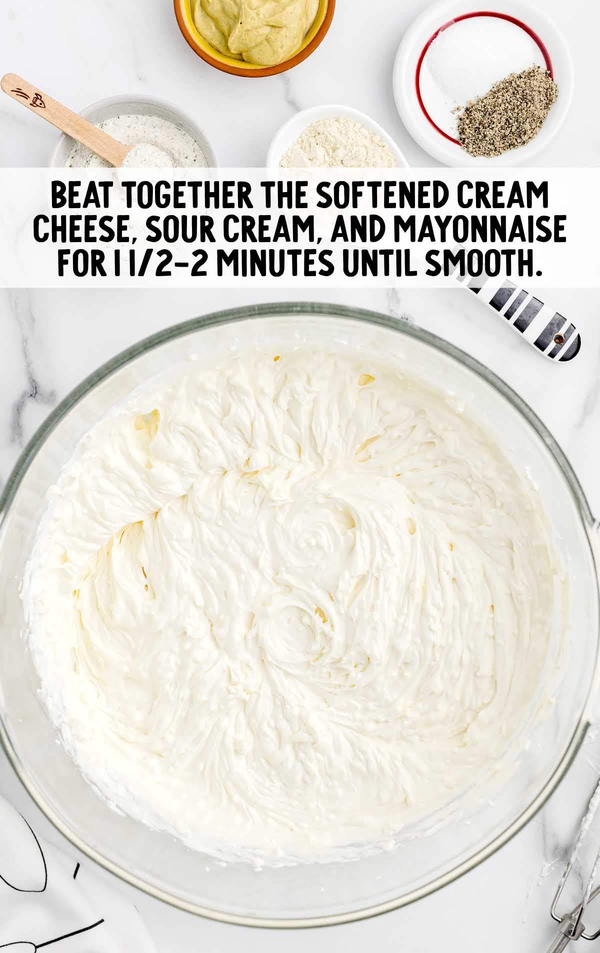softened cream cheese, sour cream, and mayonnaise beat together in a bowl