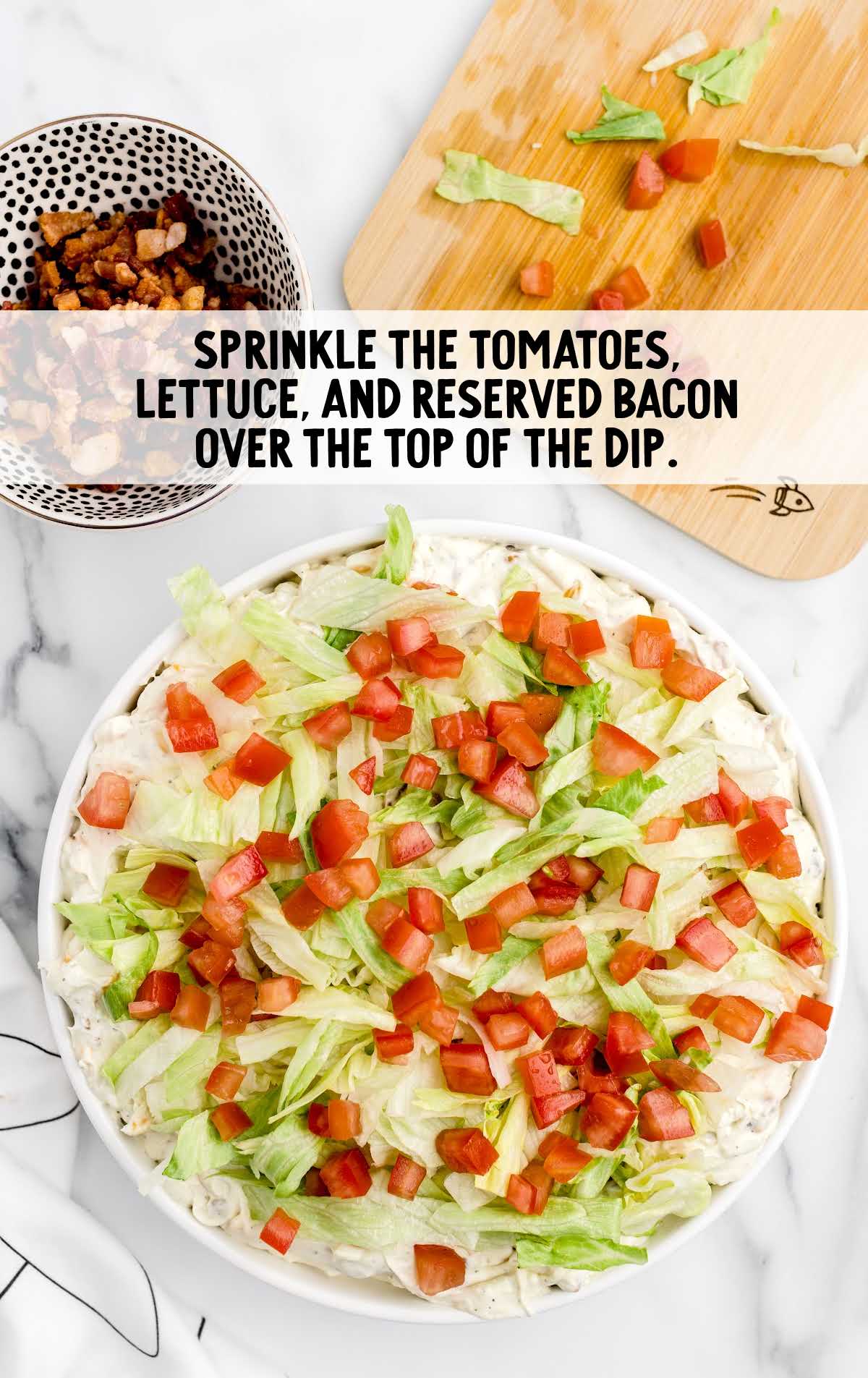tomatoes, lettuce, and bacon sprinkled on top of the drip