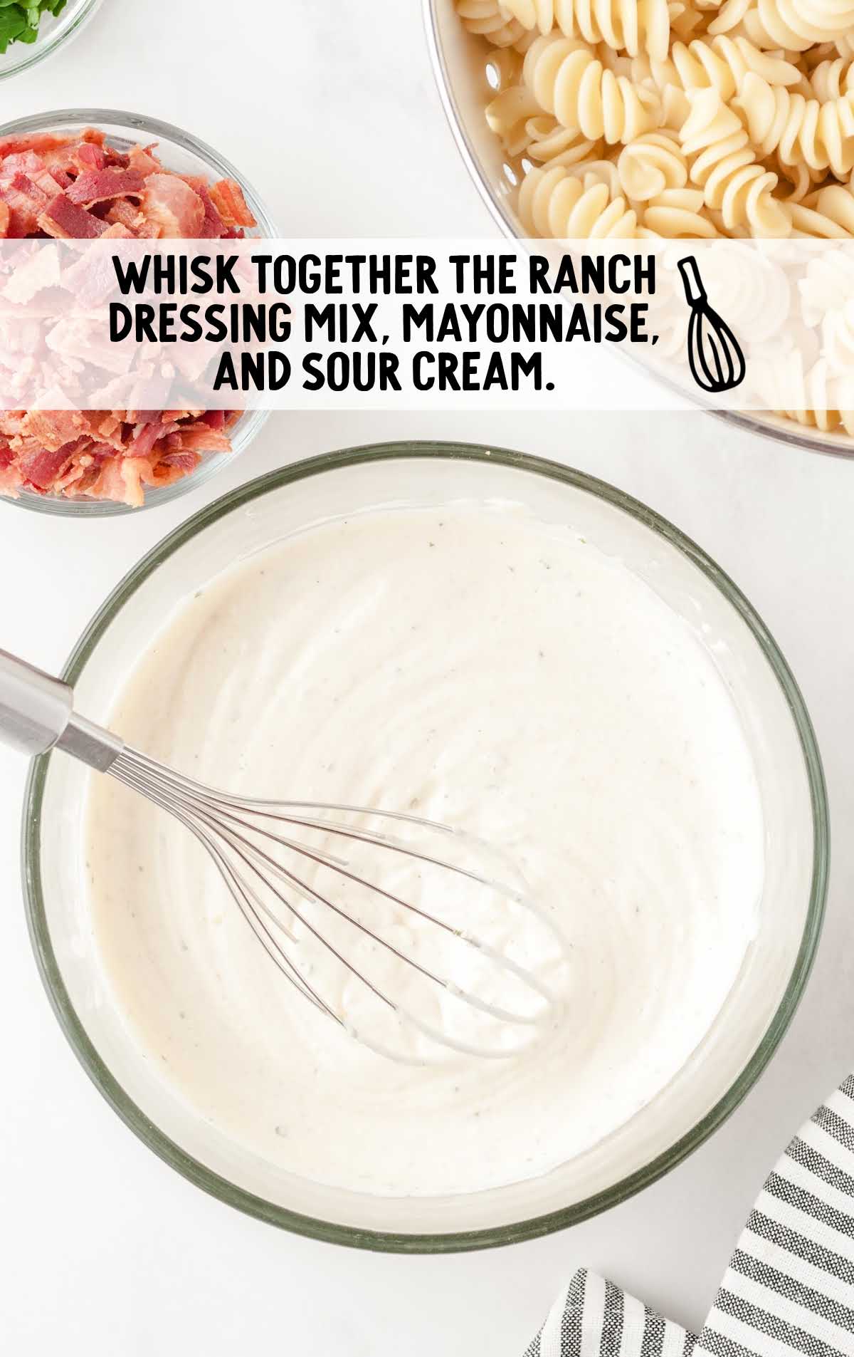ranch dressing mix, mayonnaise, and sour cream whisked together in a bowl