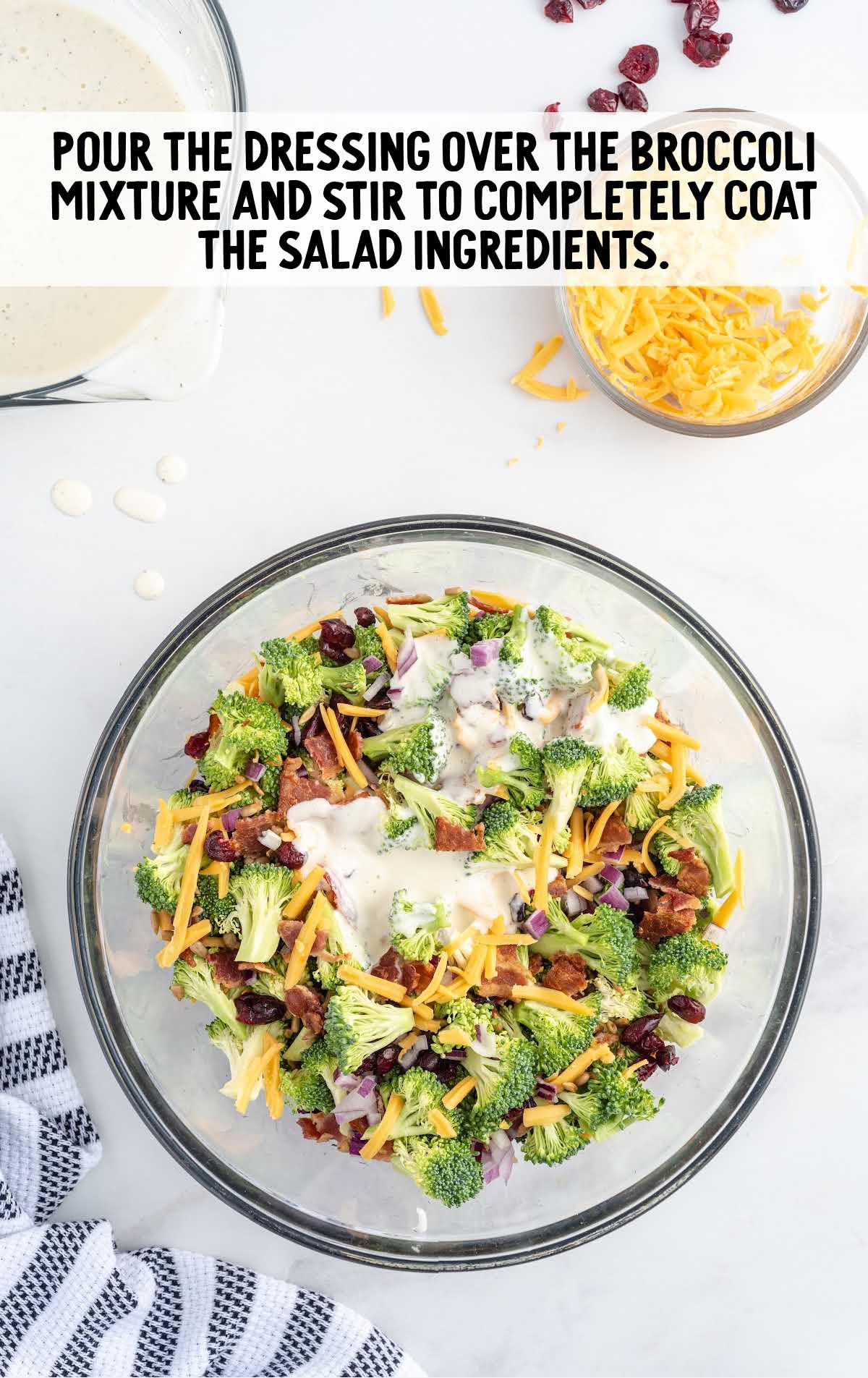 dressing poured on top the salad in a bowl
