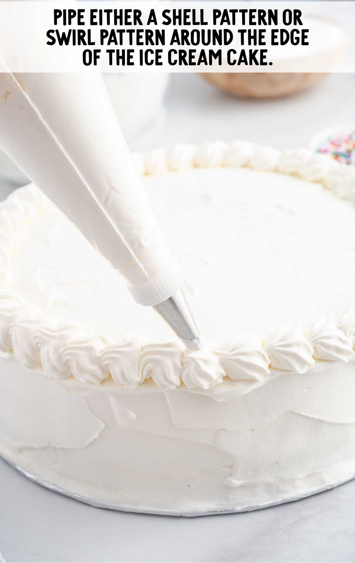 cake being piped around the edges