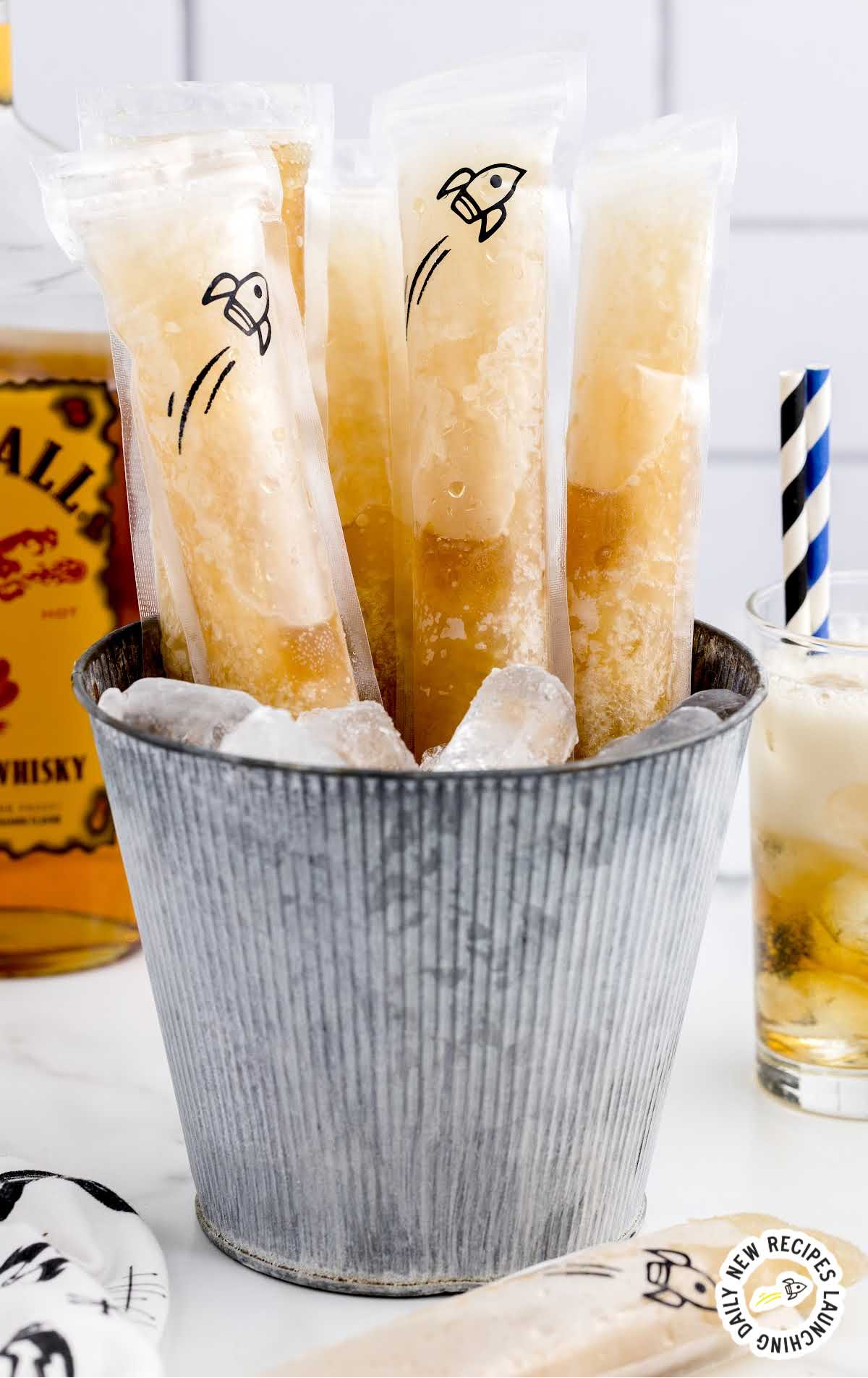 a bunch of Fireball Whisky Popsicles in a bucket of ice