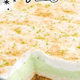Key Lime Pie Lasagna in a baking dish with a piece missing