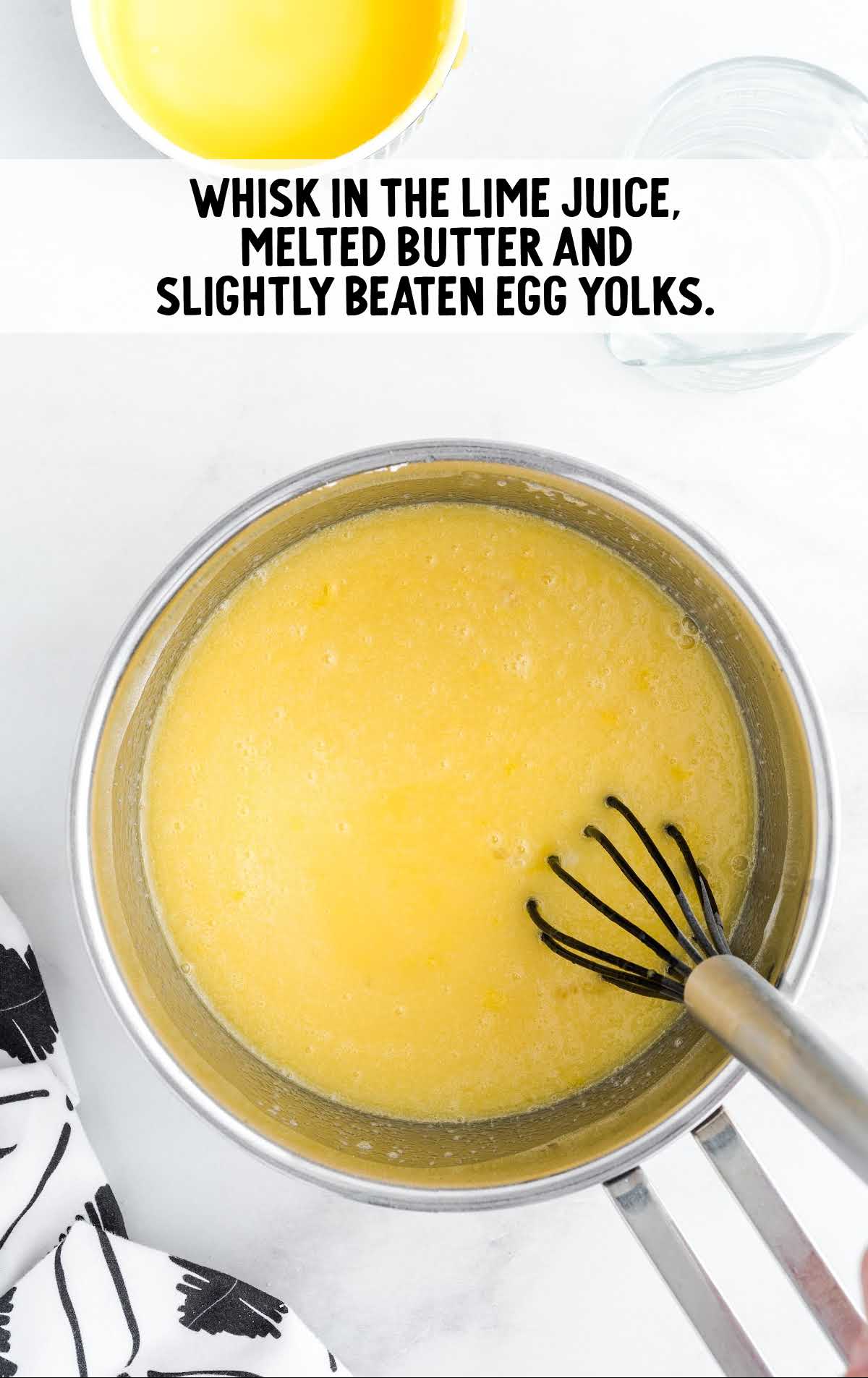 lime juice, butter, and eggs whisked together in a pan