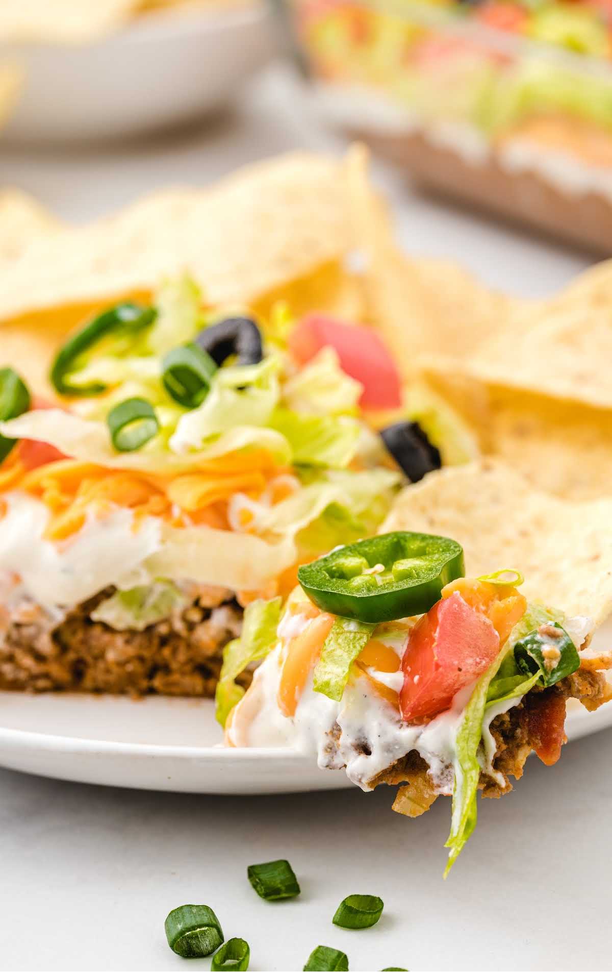 close up shot of Layered Taco Salad on a plate