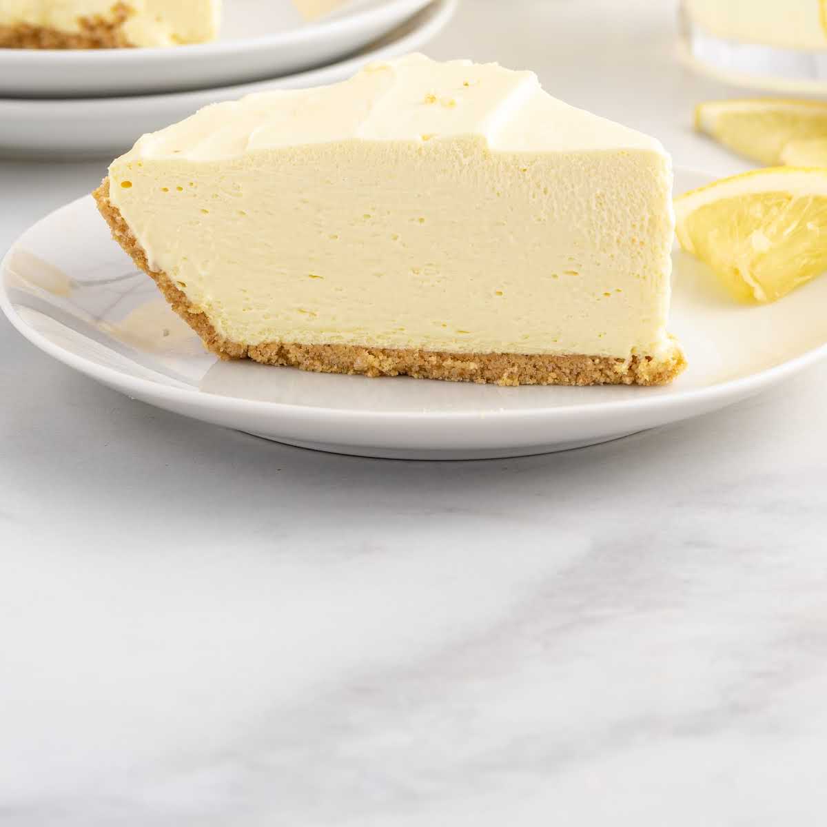 close up shot of a slice of Lemonade Pie on a plate