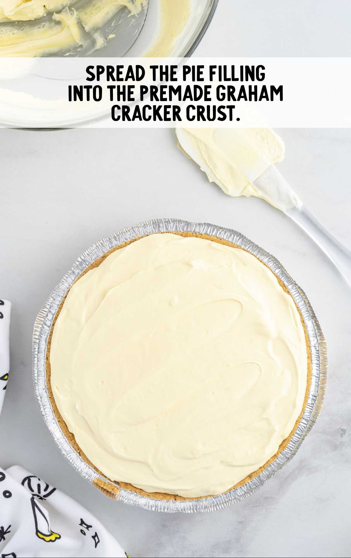filling spread into the graham cracker crust