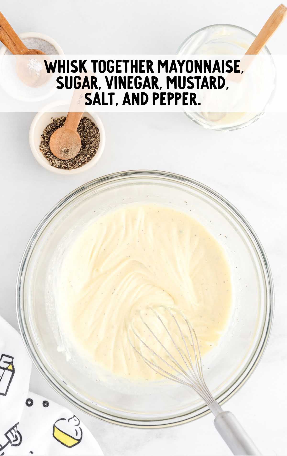 mayonnaise, sugar, vinegar, mustard, salt and pepper whisked together in a bowl