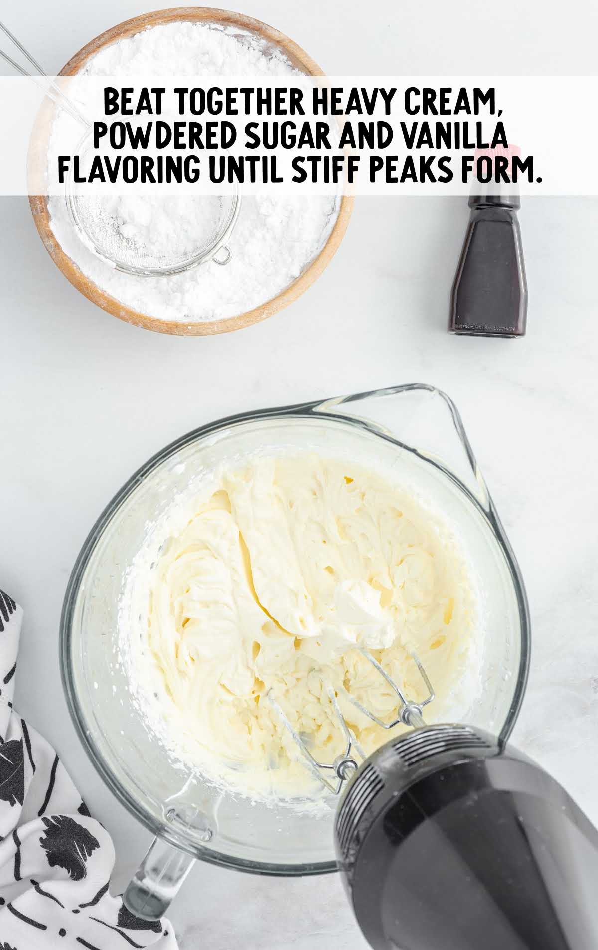 heavy cream, powdered sugar and vanilla blended together in a bowl