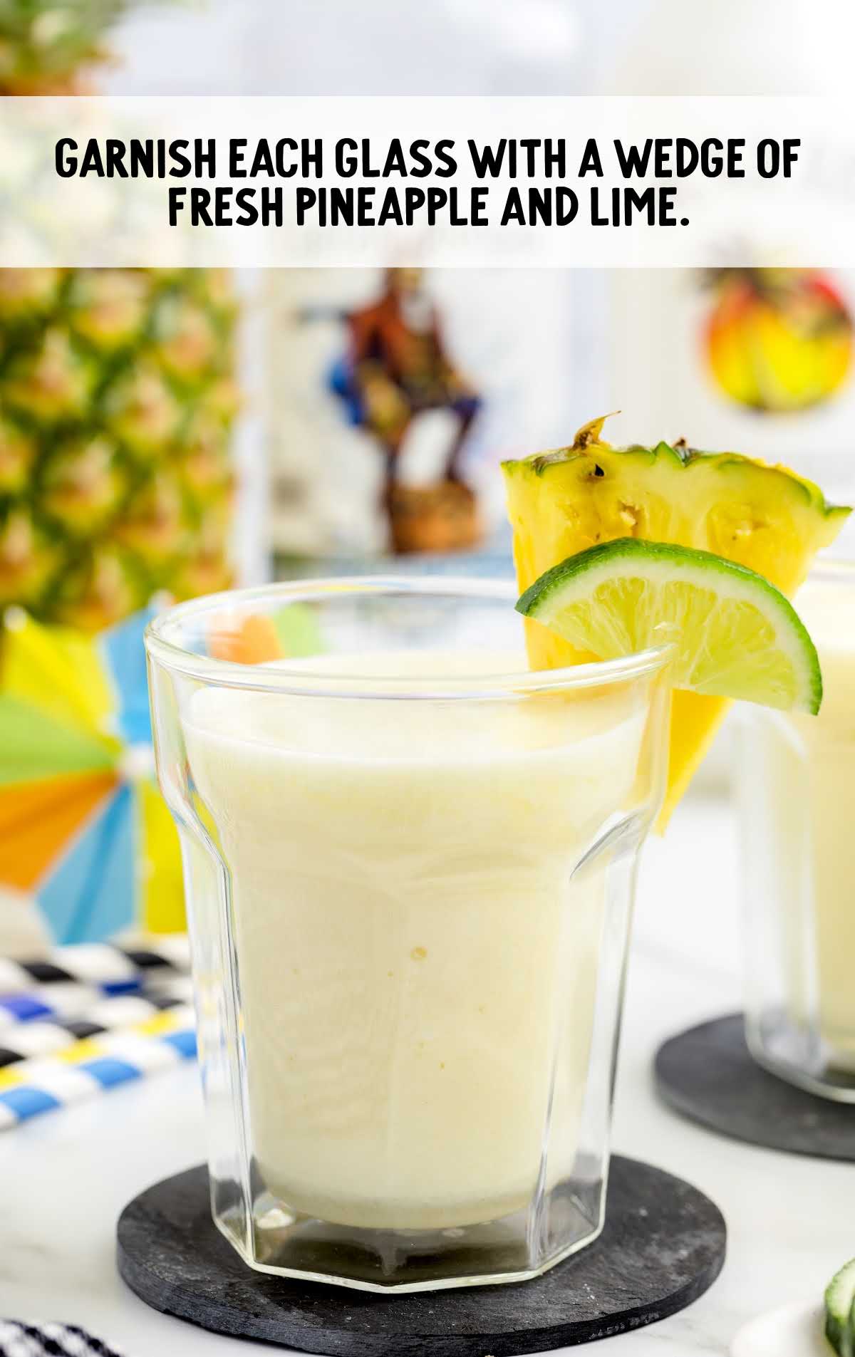 Pineapple Cooler garnished with pineapple and lime wedge
