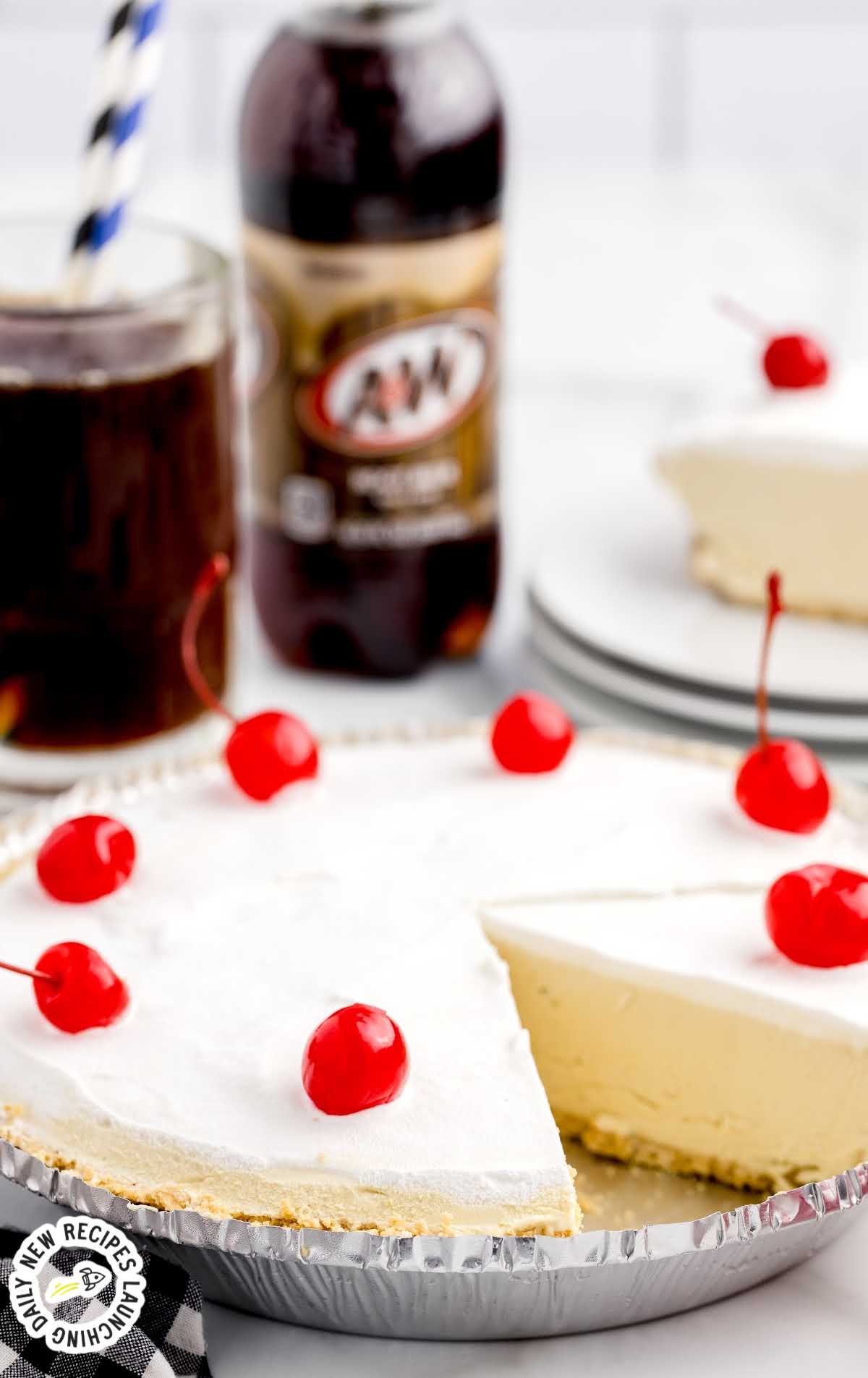 a close up shot of Root Beer Float Pie with a slice taken out topped with cherries
