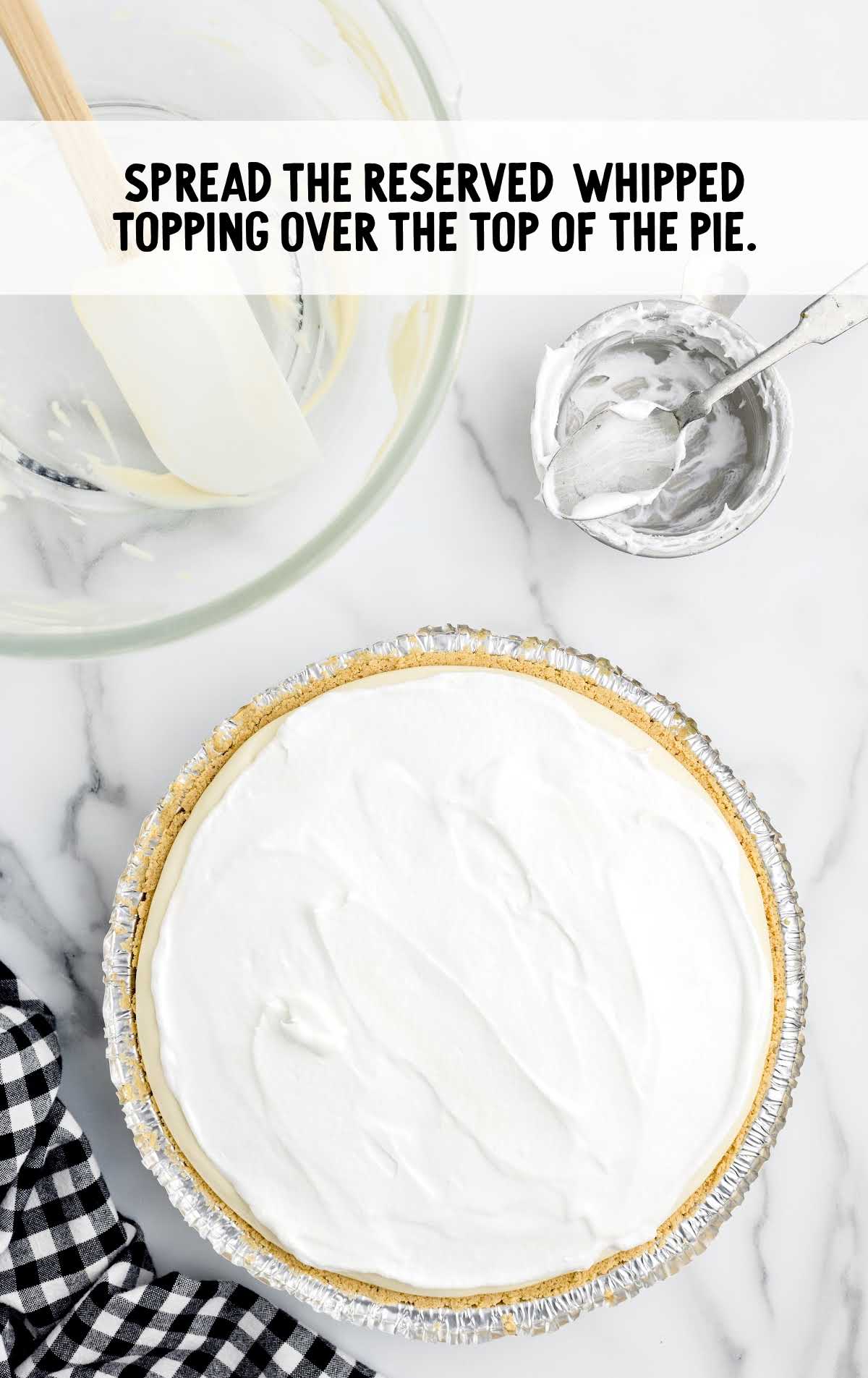 whipped topping spread over the pie