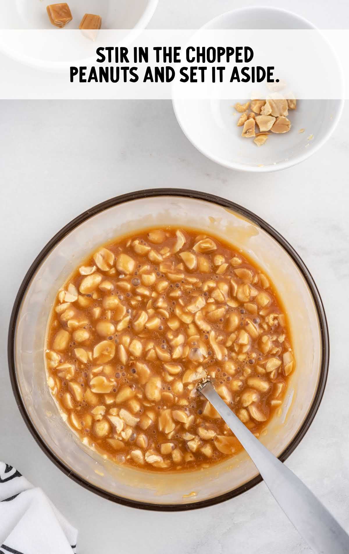 chopped peanut stir with the caramel bit and water mixture in a bowl