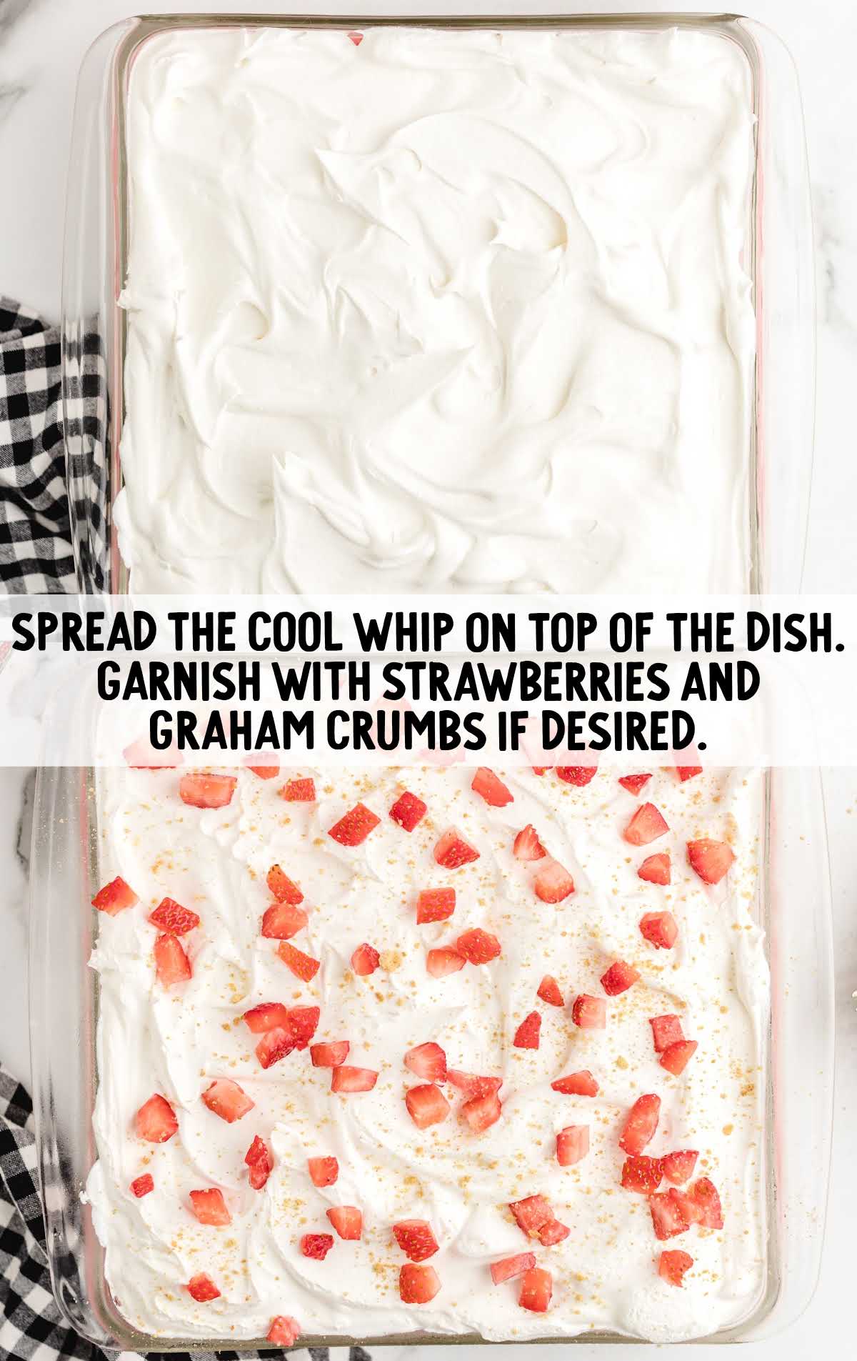 cool whip, sliced strawberries and graham crackers spread on top of the cake in a baking dish