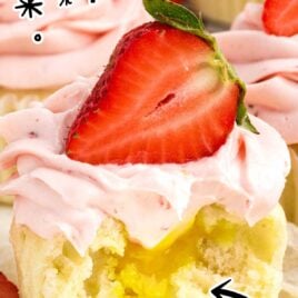 Strawberry Lemon Cupcakes topped with a strawberry with a bite taken out of it