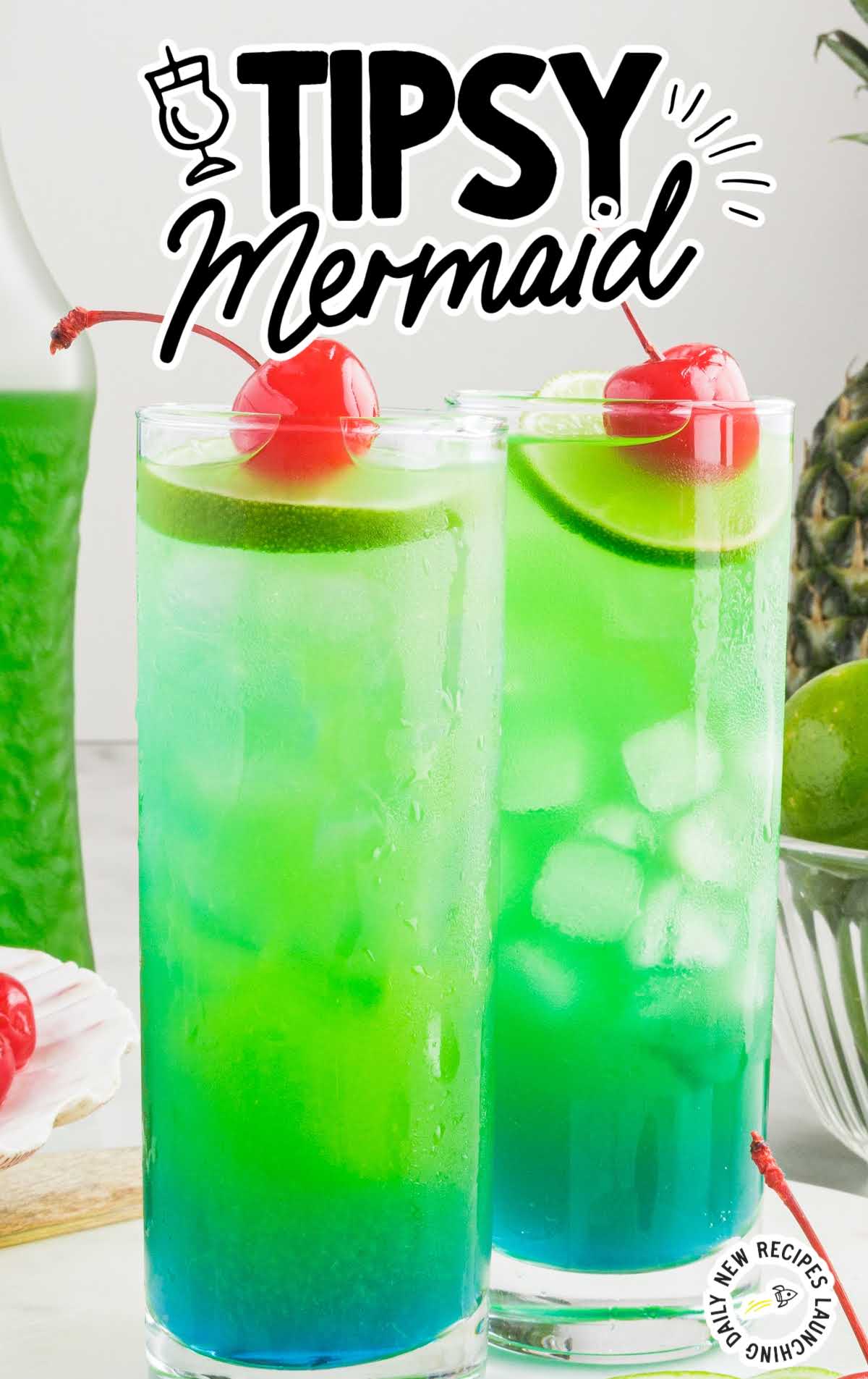 close up shot of Tipsy Mermaids topped with cherry and lime