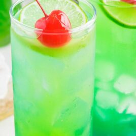 close up shot of Tipsy Mermaids topped with cherry and lime