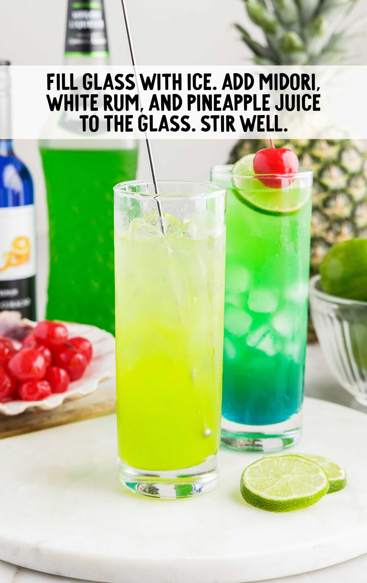 ice, Midori, rum, and pineapple juice stir in a glass